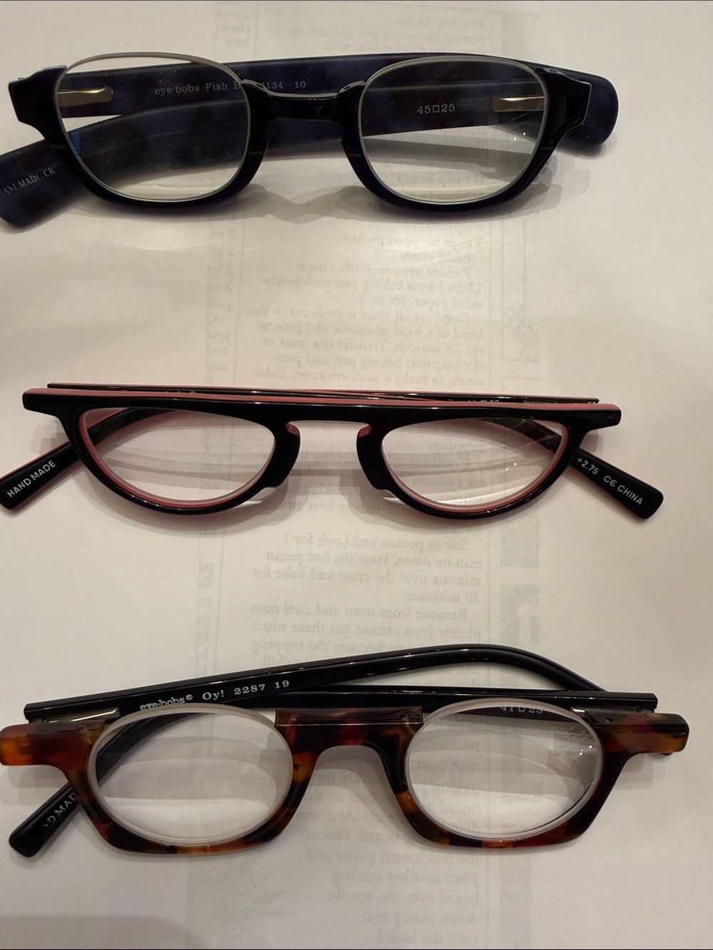 Three pairs of Eyebob readers. 2.75 Black, Pink, Tortoiseshell